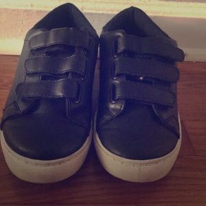 These are black Velcro shoes.